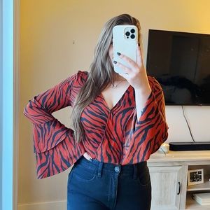 Burnt orange zebra print Express bodysuit with bell sleeves